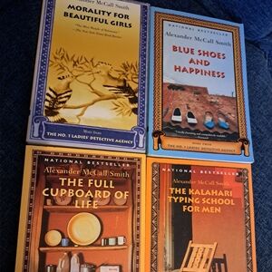 Four Alexander McCall Smith Paperback Books
